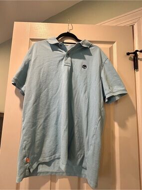 Timberland Light Blue Polo with Orange Trim and Brown Logo